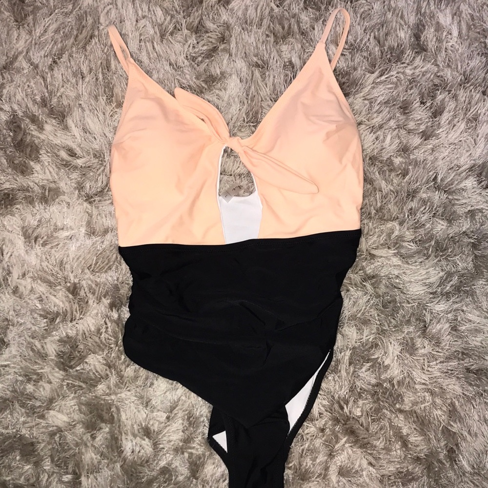 Never worn Women’s one piece swim suit